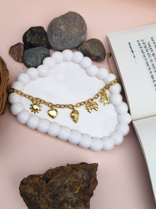 Golden Charm Bracelet – Sun, Heart, Shell & Butterfly Motifs