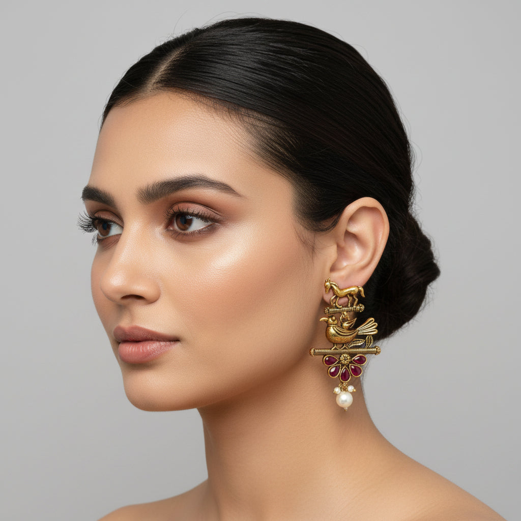 PAKSHIHAAR EARRINGS :Antique Gold-Plated Bird & Horse Statement Earrings with Ruby Red Stones