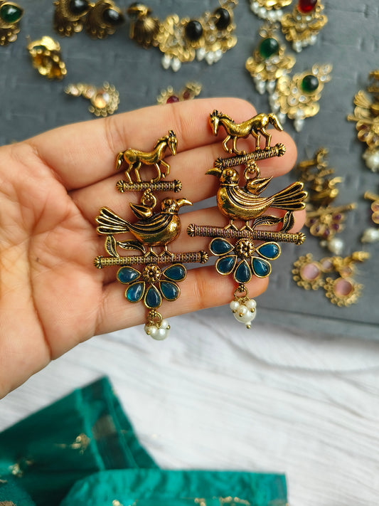 PAKSHIHAAR EARRINGS :Antique Gold-Plated Bird & Horse Statement Earrings with Ruby Red Stones