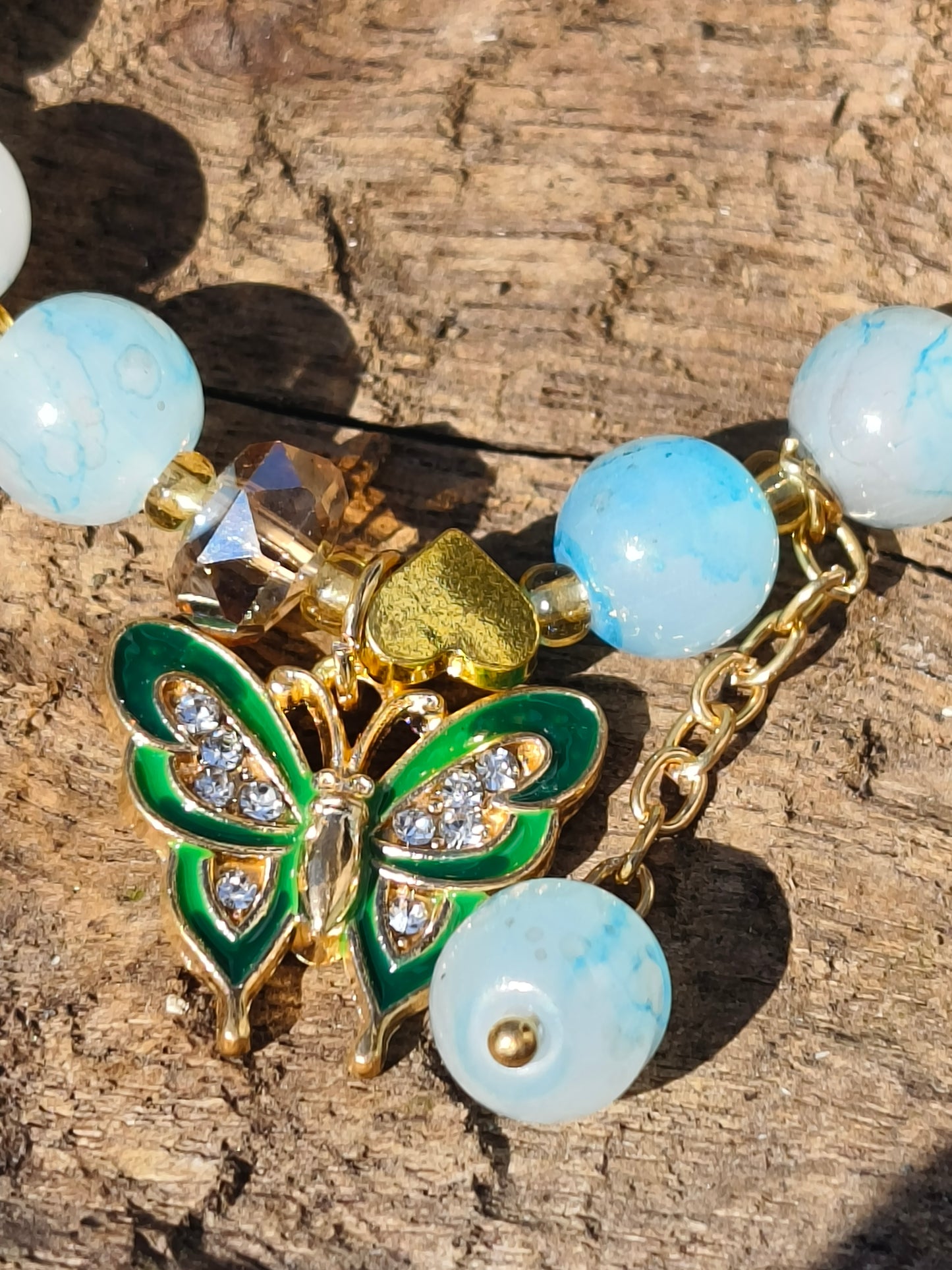 Sky Blue Beaded Bracelet with Green Butterfly Charm