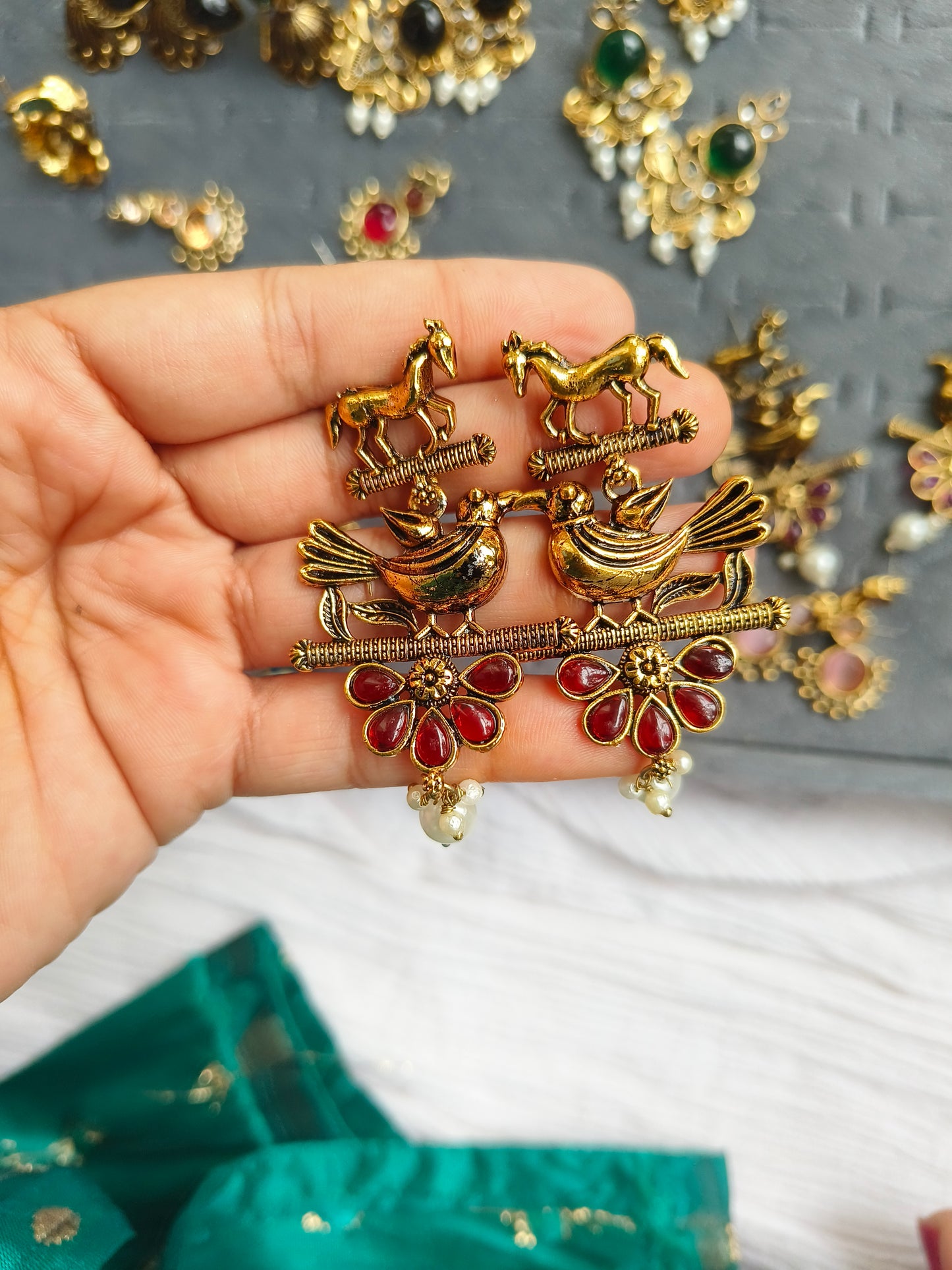 PAKSHIHAAR EARRINGS :Antique Gold-Plated Bird & Horse Statement Earrings with Ruby Red Stones