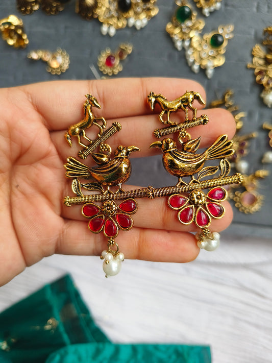 PAKSHIHAAR EARRINGS :Antique Gold-Plated Bird & Horse Statement Earrings with Ruby Red Stones