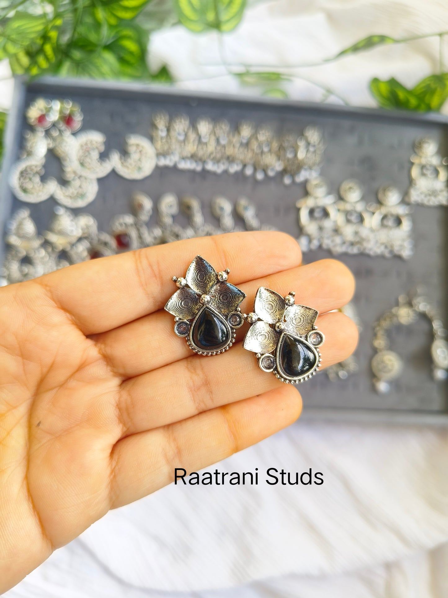 RAATRANI"Oxidised Silver Floral Stud Earrings with Black Stone – Ethnic Statement Jewellery"