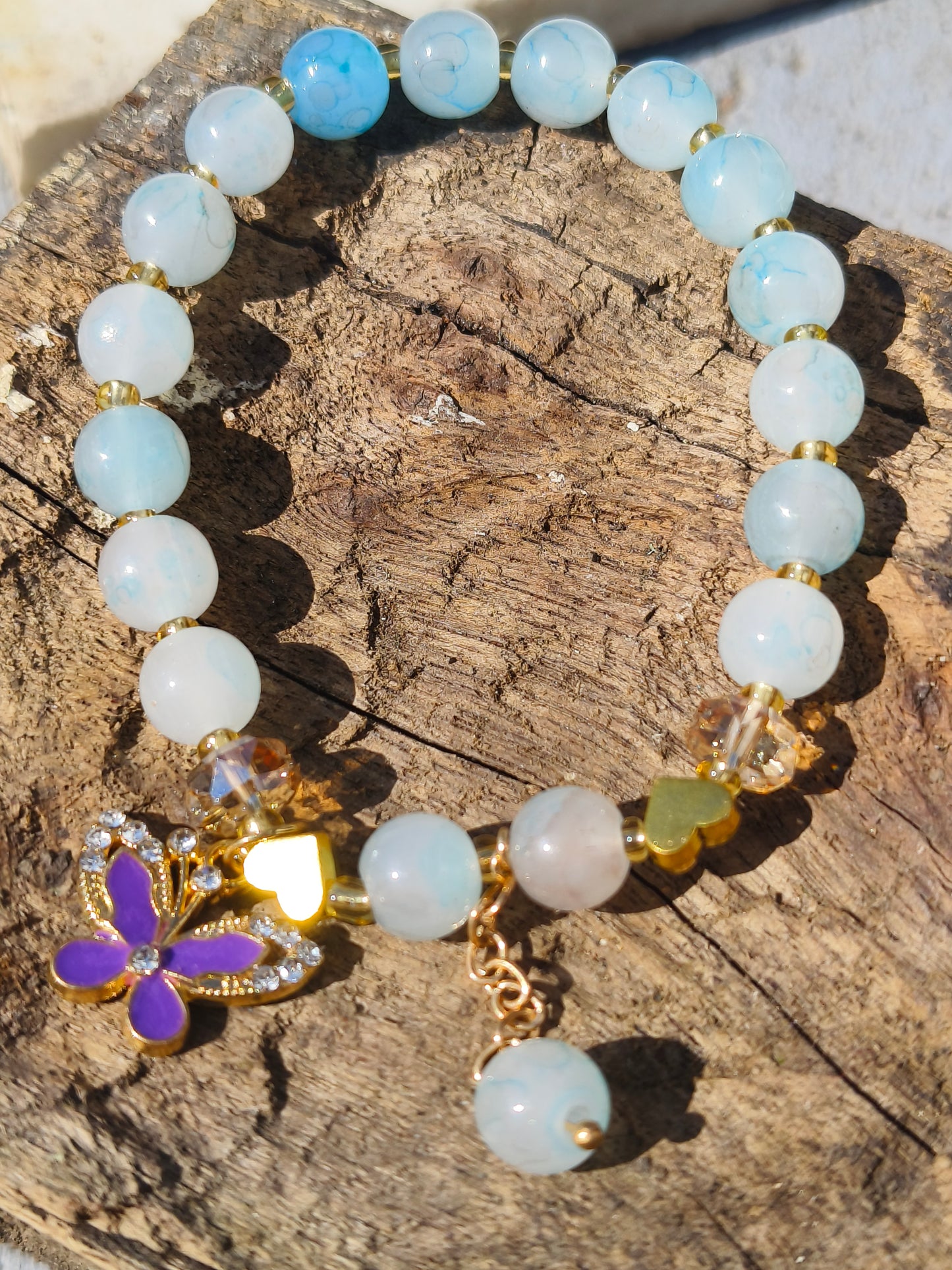Sky Blue Beaded Bracelet with Green Butterfly Charm