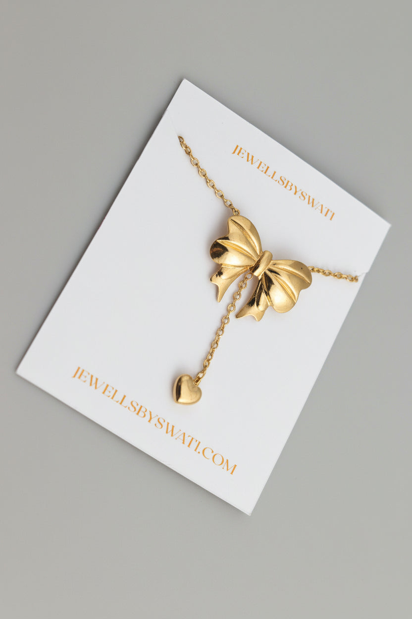 Gold Bow Pendant Necklace with Heart Drop | Cute Feminine Statement Chain