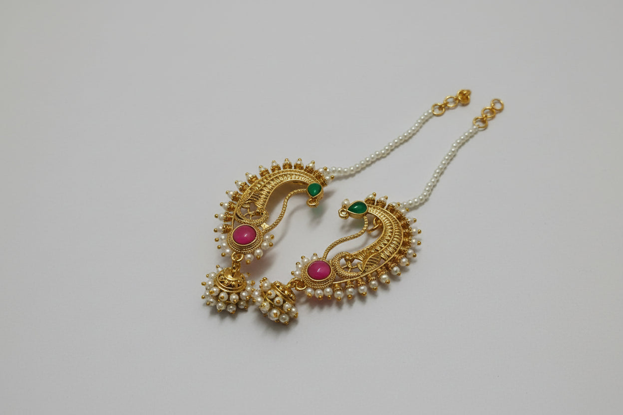 Gold Plated Temple Peacock Jhumka Earrings with Pearl Chain & Pink Green Stones